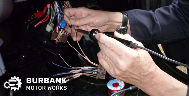 Technician Fixing A Dashboard