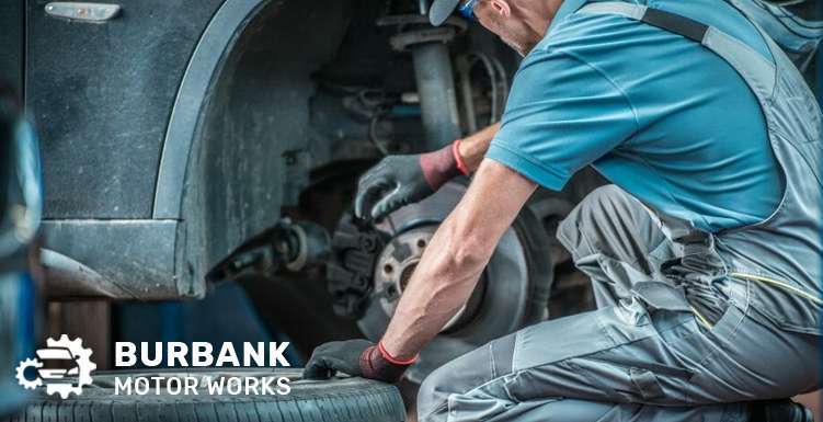 Mechanic repairing a car’s brake system that has bad symptoms