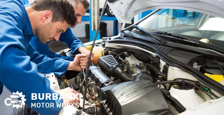 Mechanic performing engine maintenance